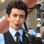 young man playing bagpipes