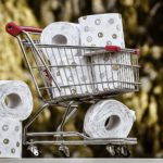 shopping basket filled with toilet roll