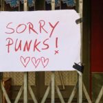 a sign outside a Berlin club saying "Sorry punks!"