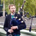 Young man playing the bagpipes