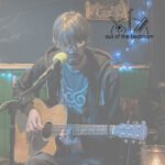 young man playing guitar and singing