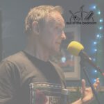 Man reciting poetry at an open mic night