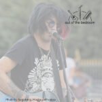 street musician singing and playing guitar