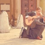 musician with acoustic guitar