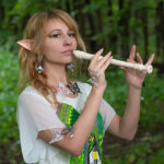 young woman playing the recorder